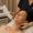 Woman receiving laser skin tightening treatment from a specialist in a clinic