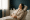 Woman relaxing in a spa chair wearing a robe, enjoying a peaceful medspa experience
