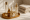 Luxury skincare products with golden lids arranged on a tray at Advanced Life Clinic.